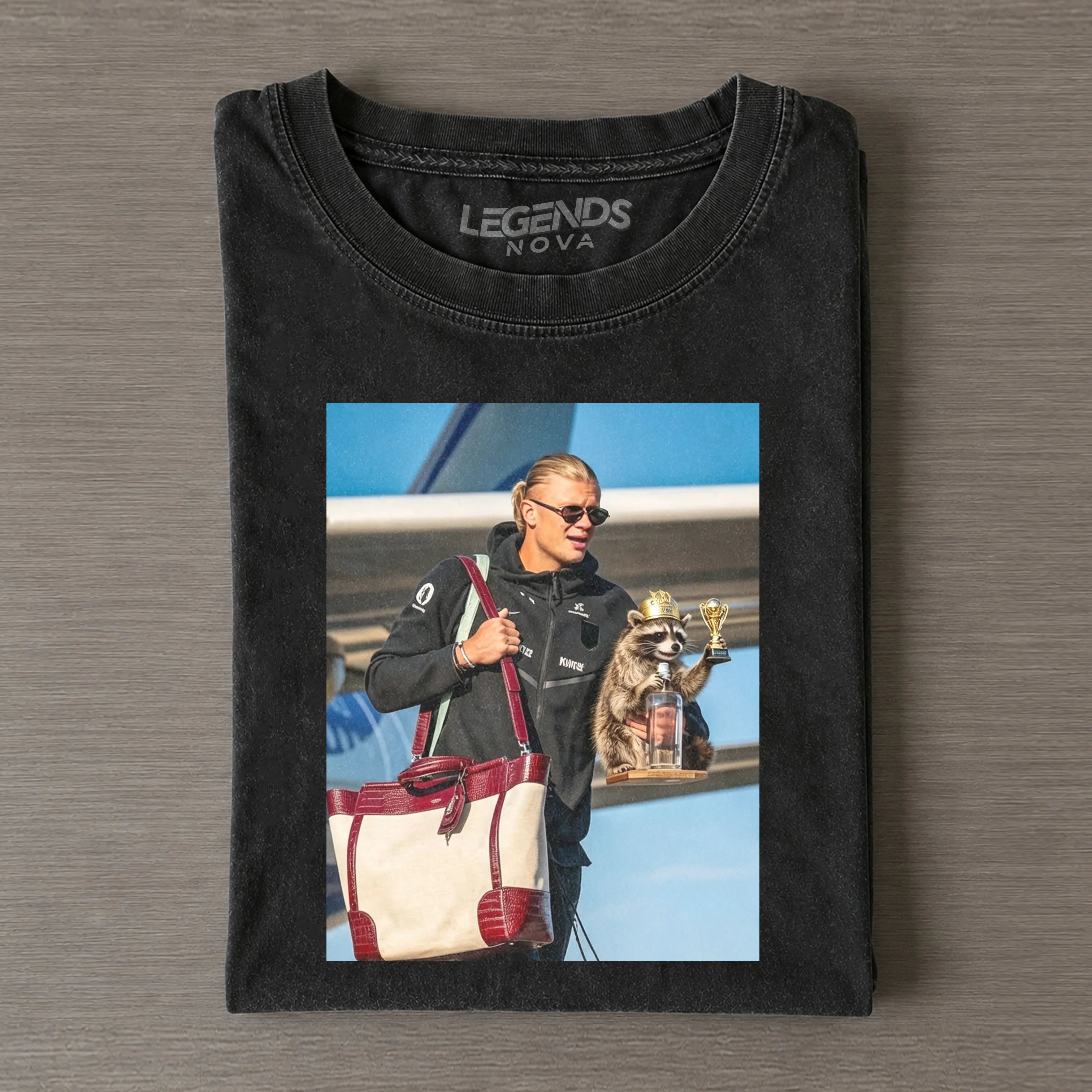 “Others hold trophies after matches, I hold my raccoon”T-shirt